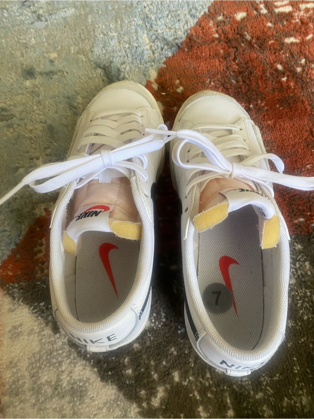 Nike women’s White Sneakers with black Swoosh